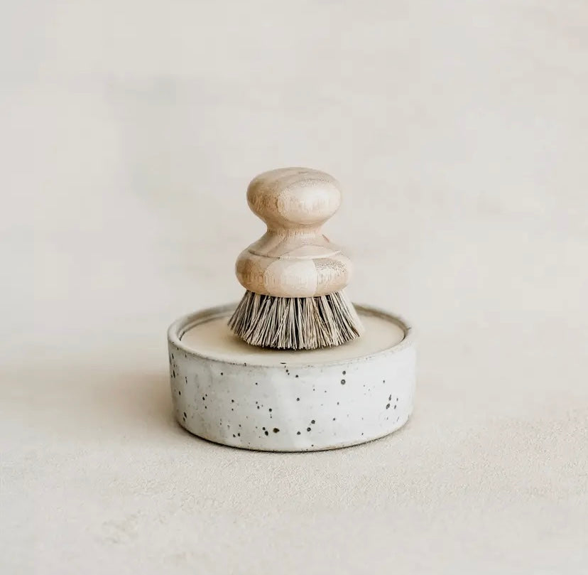 Ceramic dishwashing brush with bristles in a speckled container on a light background. (Brush sold separately)