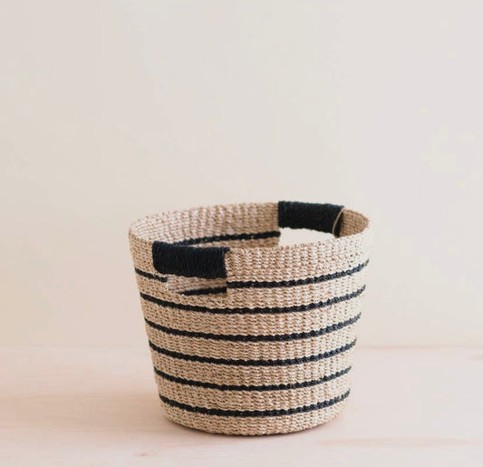 A handwoven basket made of manila hemp with black and natural color stripes, displayed against a neutral background.