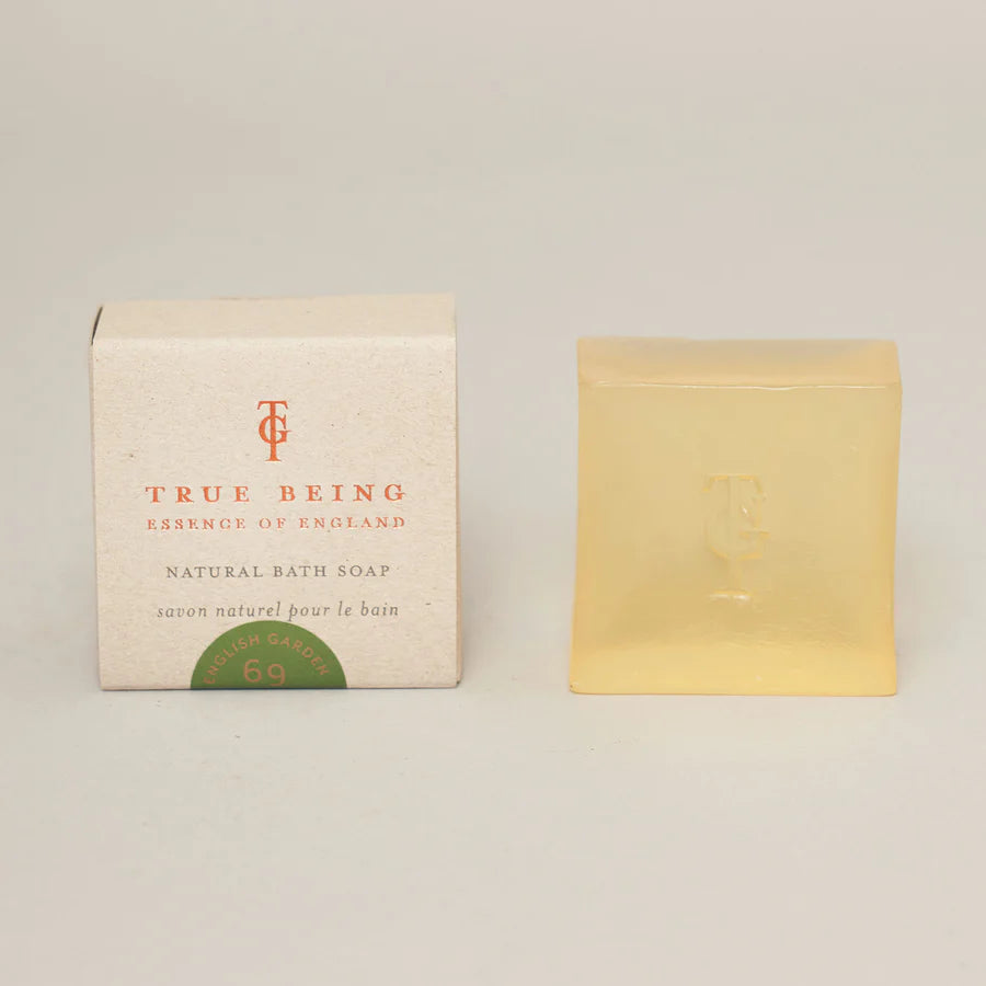 A bar of soap next to its packaging box, which has 'True Being of England' and 'Natural Bath Soap' printed on it.