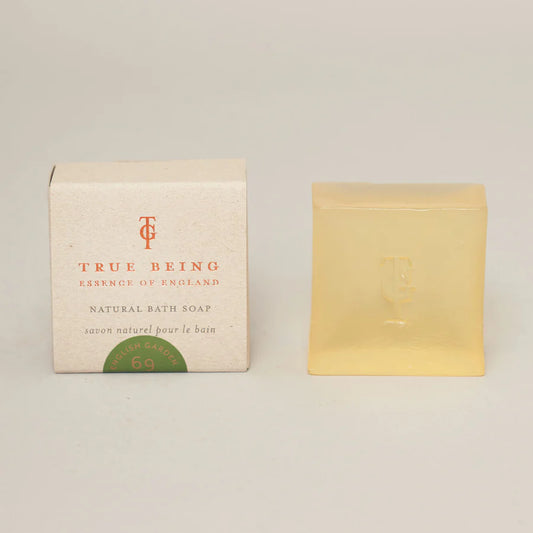 A bar of soap next to its packaging box, which has 'True Being of England' and 'Natural Bath Soap' printed on it.