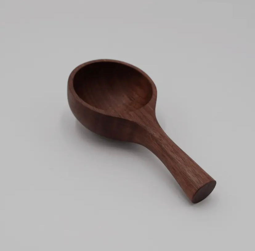 Wooden spoon on a gray background