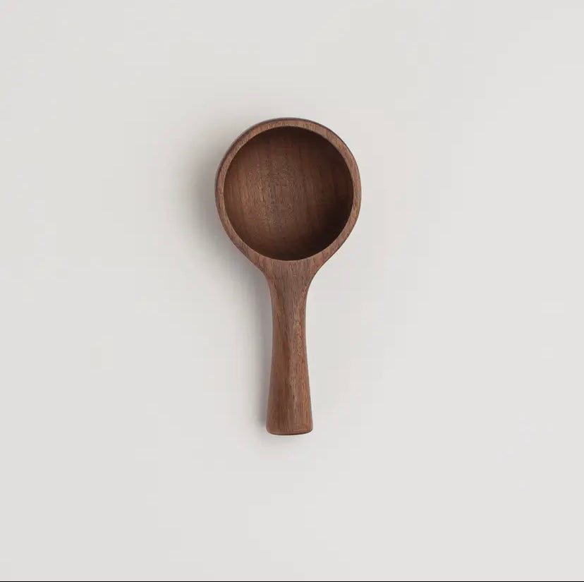 Wooden spoon on a light gray background