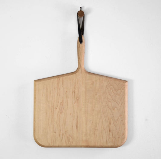 Large whalebone shaped cutting board in maple.