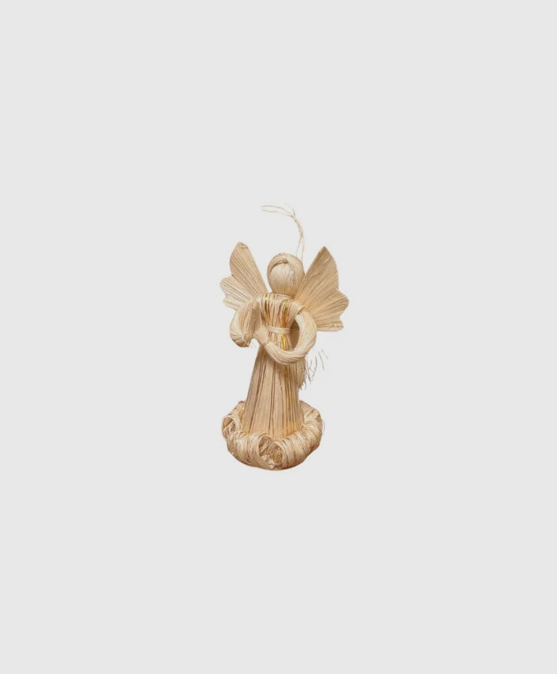 Woven angel ornament on a light beige background