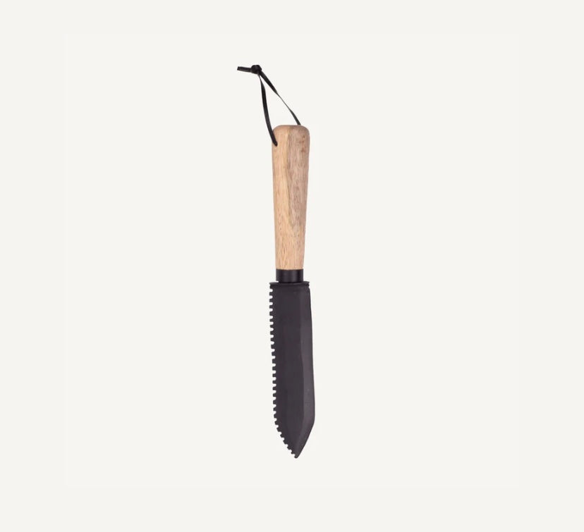 HORI HORI garden tool with serrated edge and wooden handle.